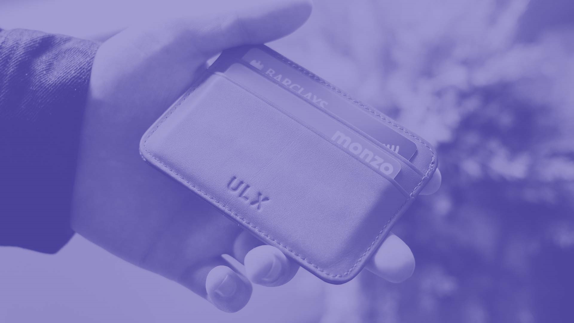 A student holding their wallet