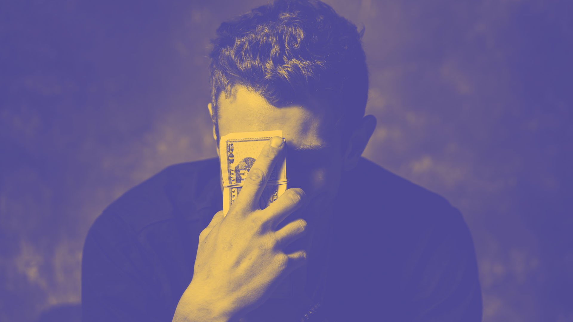 A student is looking stressed thinking about their living expenses