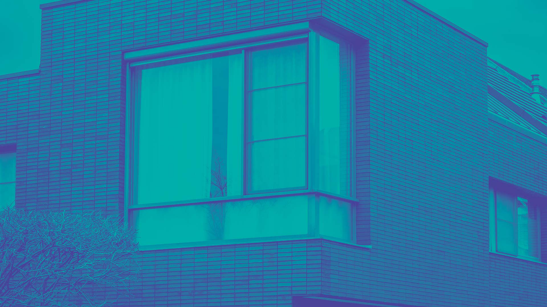 A modern house with floor to ceiling windows