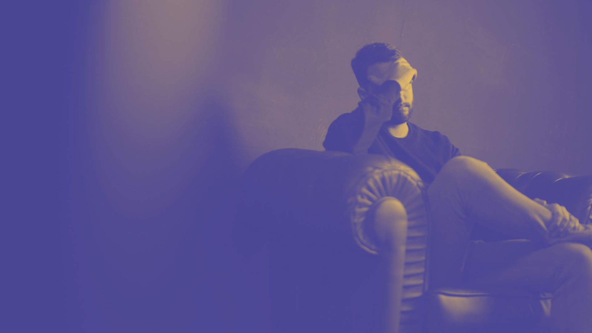 A student is sat looking stressed over the problems they have with their landlord