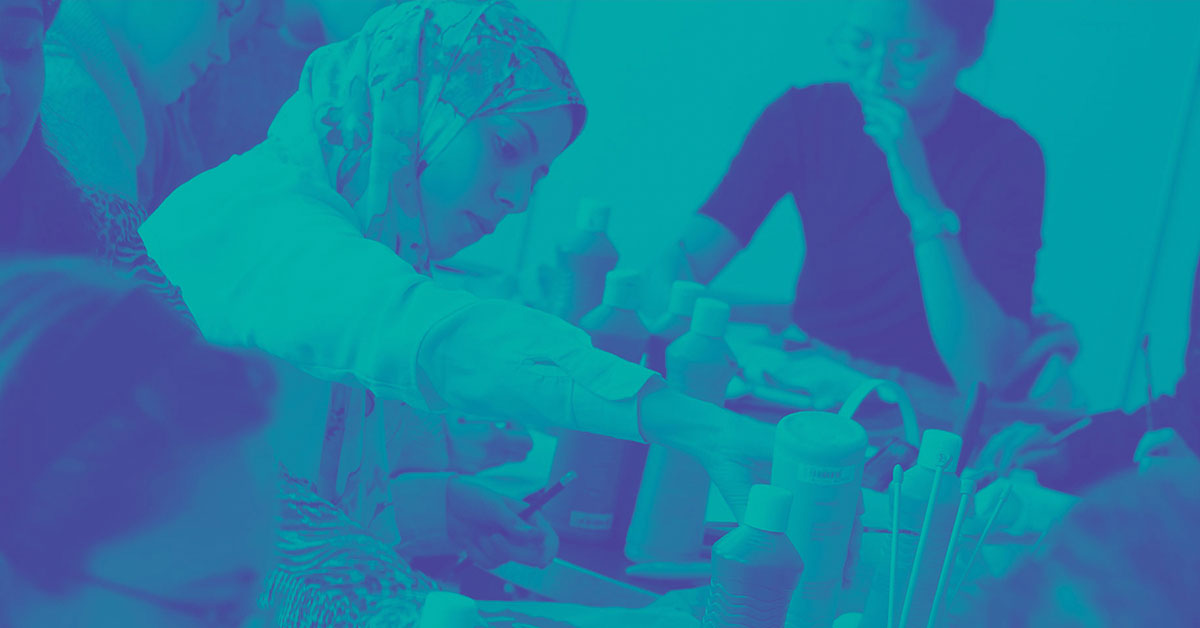 A student participating in a craft event