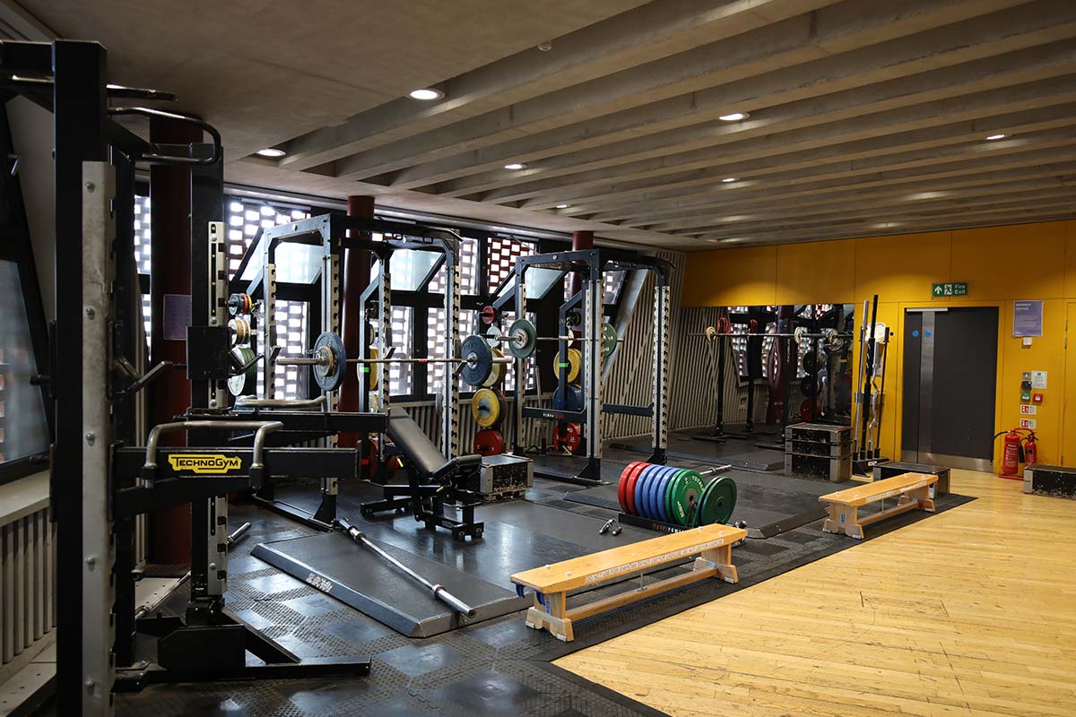 A photograph of weights machines and benches